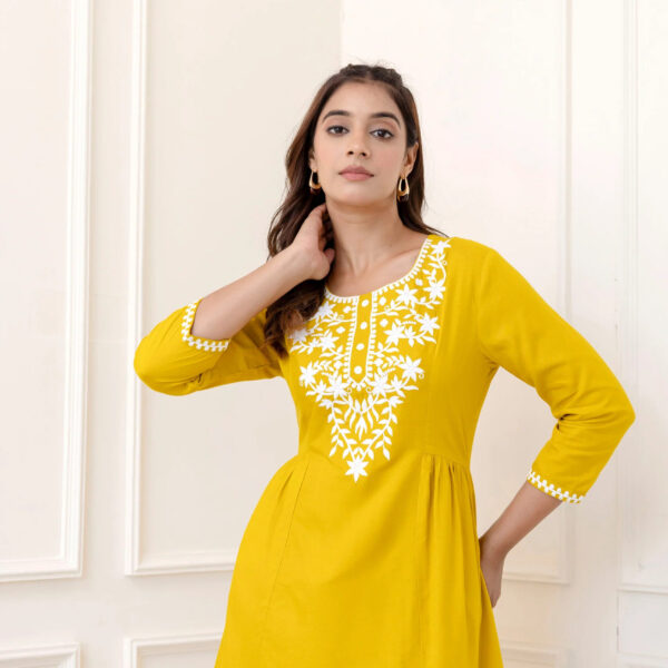 Yellow Rayon Hip Length Solid Round Neck Solid Embroidered Straight Top